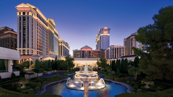 Caesars Palace hotel tower and fountain on the Las Vegas Strip at dusk
