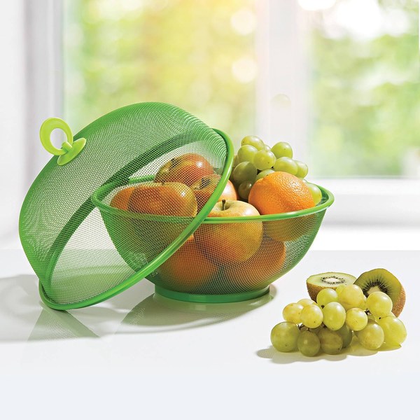 Green mesh fruit basket with lid filled with fruit