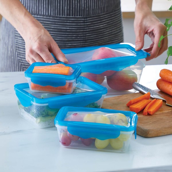 Hands holding Coopers of Stortford stretch lid containers with blue lids