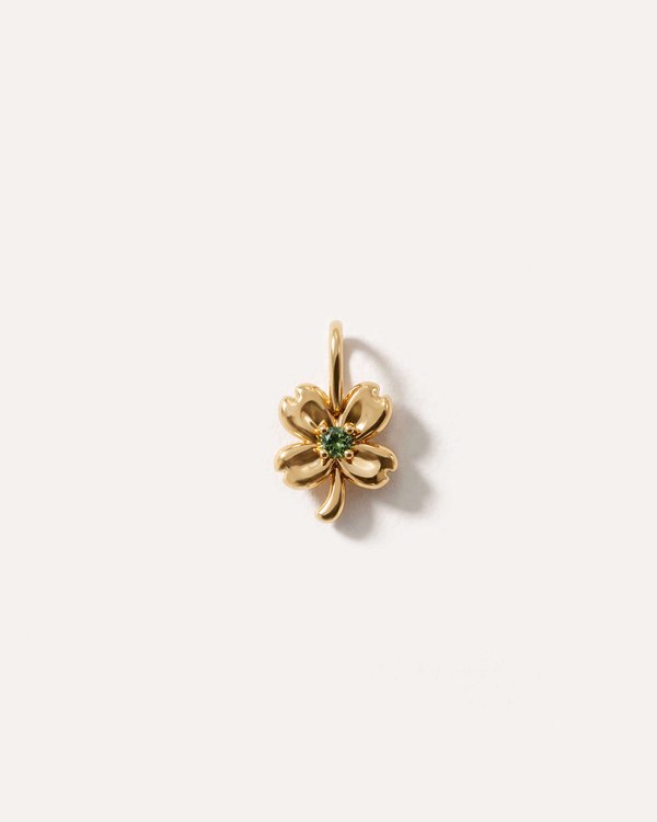 Gldn gold four leaf clover charm with a forest green gemstone centre