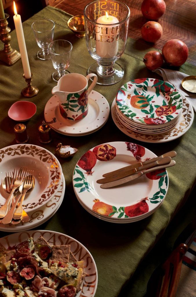 How to Set a Beautiful Table for Autumn and Winter Gatherings Autumn dinner table set with pomegranate pottery, candles and glassware