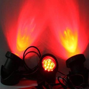 Underwater pond spotlights glowing red and orange at night