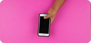 Switching to Lebara: Keep Your Number, SIM or eSIM, Step by Step Hand holding a smartphone against a bright pink background